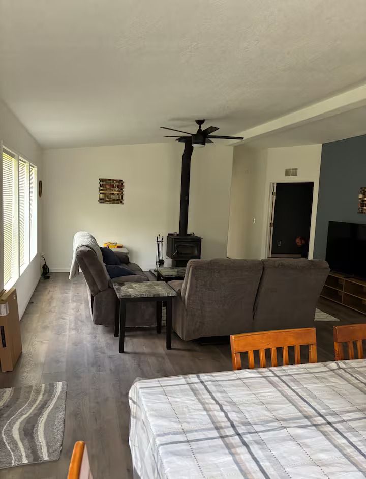 Indian Valley Outfitters ranch lodge living room with wood stove